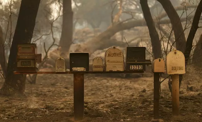 Mailboxes are still standing after the Airport Fire swept through Tuesday, Sept. 10, 2024, in El Cariso, an unincorporated community in Riverside County, Calif. (AP Photo/Eric Thayer)