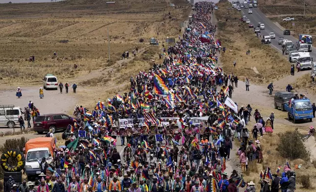 Supporters of former President Evo Morales march to the capital to protest the government of current President Luis Arce near El Alto, Bolivia, Sunday, Sept. 22, 2024. (AP Photo/Juan Karita)