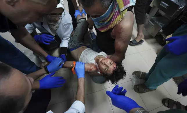 A Palestinian child wounded in the Israeli bombardment of the Gaza Strip is treated in a hospital in Deir al-Balah, Monday, Sept. 23, 2024. (AP Photo/Abdel Kareem Hana)