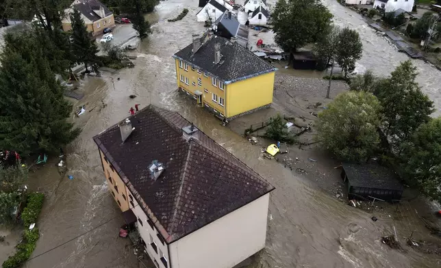 A view of flooded houses in Jesenik, Czech Republic, Sunday, Sept. 15, 2024. (AP Photo/Petr David Josek)