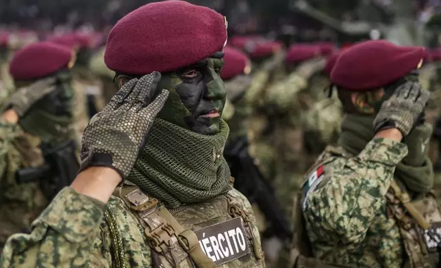 A soldier participates in the Independence Day military parade in the Zocalo, Mexico City's main square, Monday, Sept. 16, 2024. (AP Photo/Felix Marquez)