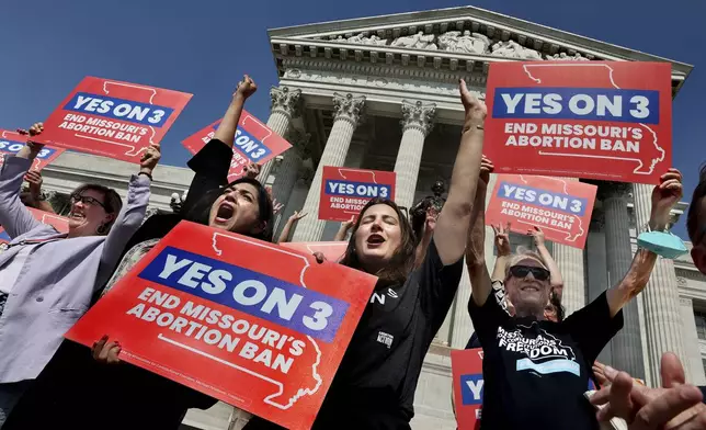 Amendment 3 supporters Luz Maria Henriquez, second from left, executive director of the ACLU Missouri, celebrates with Mallory Schwarz, center, of Abortion Action Missouri, after the Missouri Supreme Court in Jefferson City, Mo., ruled that the amendment to protect abortion rights would stay on the November ballot in on Tuesday, Sept. 10, 2024. (Robert Cohen/St. Louis Post-Dispatch via AP)