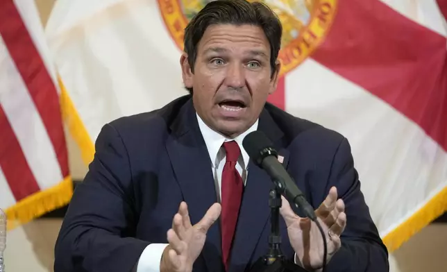 Florida Gov. Ron DeSantis gestures as he answers questions after a roundtable discussion at the Roberto Alonso Community Center, Monday, Sept. 9, 2024, in Miami Lakes, Fla. (AP Photo/Wilfredo Lee)