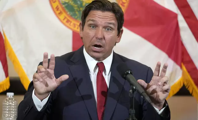 Florida Gov. Ron DeSantis gestures as he answers questions after a roundtable discussion at the Roberto Alonso Community Center, Monday, Sept. 9, 2024, in Miami Lakes, Fla. (AP Photo/Wilfredo Lee)