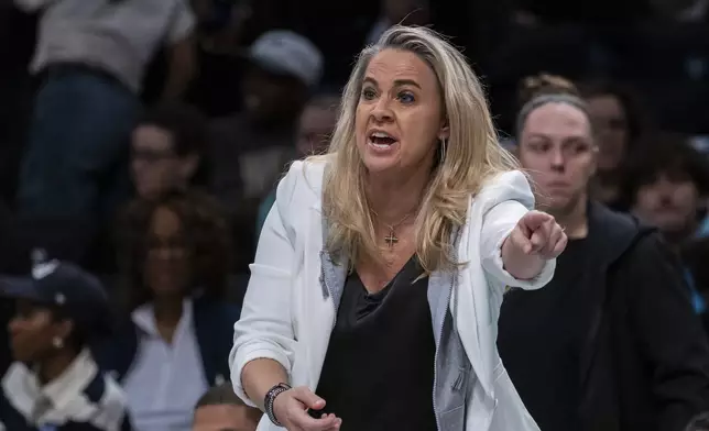 Las Vegas Aces head coach Becky Hammon reacts during the first half of a WNBA basketball second-round playoff game against the New York Liberty, Sunday, Sept. 29, 2024, in New York. (AP Photo/Corey Sipkin)