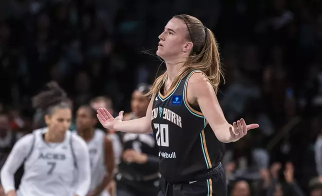 New York Liberty guard Sabrina Ionescu (20) celebrates after a basket during the second half of a WNBA basketball second-round playoff game against the Las Vegas Aces, Sunday, Sept. 29, 2024, in New York. (AP Photo/Corey Sipkin)