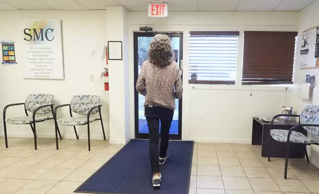 Methadone patient Irene Garnett, 44, of Phoenix, prepares to leave a clinic after taking her medication in Scottsdale, Ariz., on Monday, Aug. 26, 2024. (AP Photo/Ross D. Franklin)