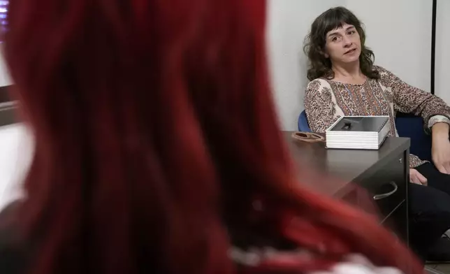 Methadone patient Irene Garnett, 44, of Phoenix, meets with counselor Melodie Reece at a clinic in Scottsdale, Ariz., on Monday, Aug. 26, 2024. (AP Photo/Ross D. Franklin)