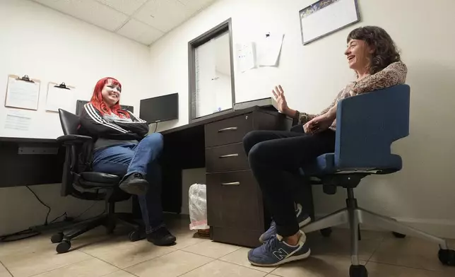 Methadone patient Irene Garnett, right, 44, of Phoenix, meets with counselor Melodie Reece at a clinic in Scottsdale, Ariz., on Monday, Aug. 26, 2024. (AP Photo/Ross D. Franklin)