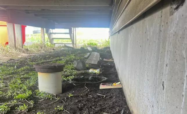 This June 2024 photo provided by Aleut Community of St. Paul Island Ecosystem Conservation Office shows a rat trap that was placed under a residential building on St. Paul Island, Alaska, after a resident reported an alleged sighting. (Aleut Community of St. Paul Island Ecosystem Conservation Office via AP)