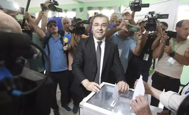 Presidential candidate and leader of the FFS party, Youcef Aouchich, casts his ballot inside a polling station during the presidential elections, Saturday, Sept. 7, 2024, in Tizi Ouzou, Algeria. (AP Photo)