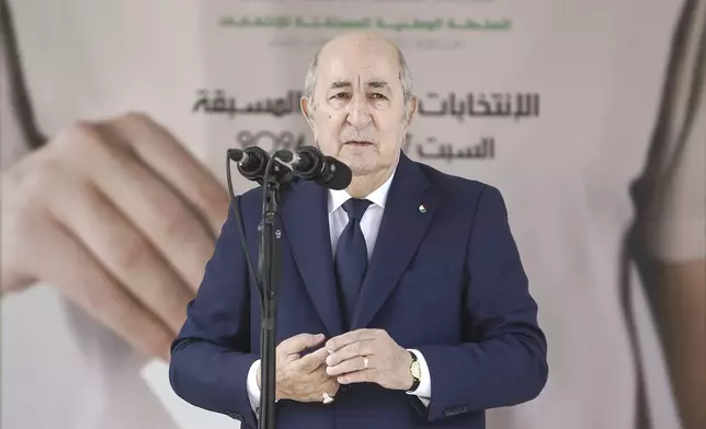 Algerian president and candidate for re-election Abdelmajid Tebboune speaks after casting his ballot inside a polling station during the presidential elections, Saturday, Sept. 7, 2024, in Algiers, Algeria. (AP Photo)