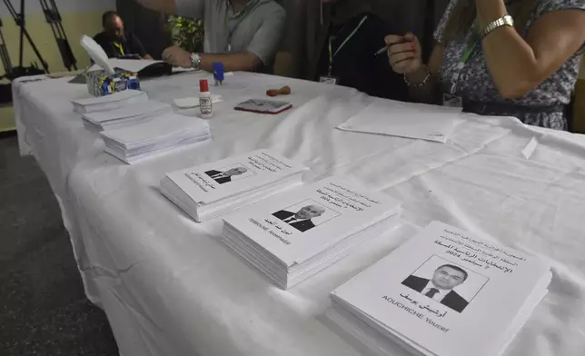 Ballots showing presidential candidates inside a polling station during the presidential election, Saturday, Sept. 7, 2024, in Algiers, Algeria. (AP Photo/Fateh Guidoum)