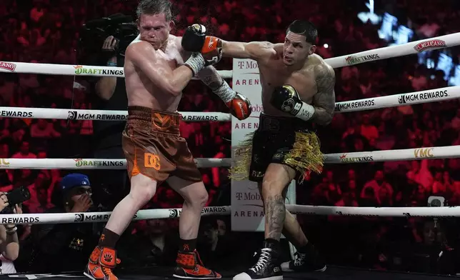 Edgar Berlanga hits Canelo Alvarez in a super middleweight title bout Saturday, Sept. 14, 2024, in Las Vegas. (AP Photo/John Locher)