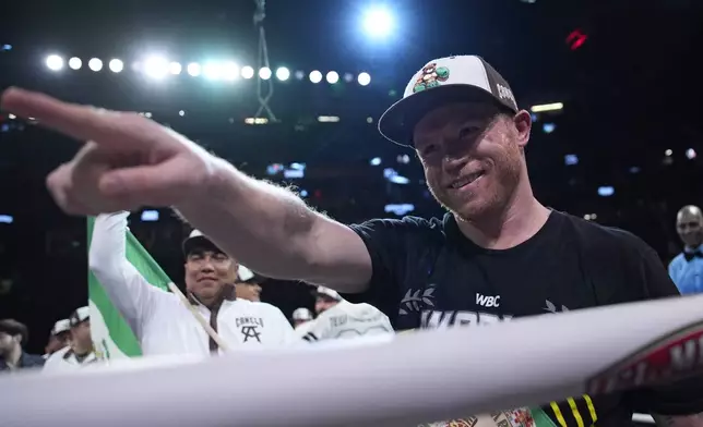 Canelo Alvarez celebrates after defeating Edgar Berlanga in a super middleweight title bout Saturday, Sept. 14, 2024, in Las Vegas. (AP Photo/John Locher)