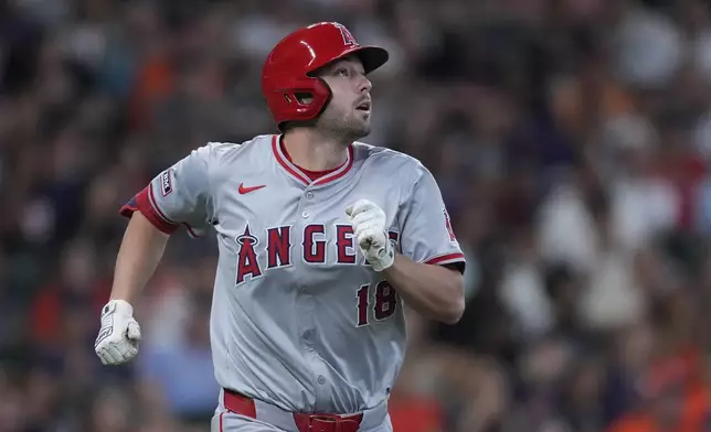 Los Angeles Angels' Nolan Schanuel watches his RBI sacrifice fly during the seventh inning of a baseball game against the Houston Astros, Sunday, Sept. 22, 2024, in Houston. (AP Photo/Kevin M. Cox)