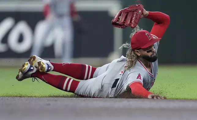 Los Angeles Angels second baseman Jack López dives but misses a base hit by Houston Astros' Yainer Diaz during the second inning of a baseball game Sunday, Sept. 22, 2024, in Houston. (AP Photo/Kevin M. Cox)