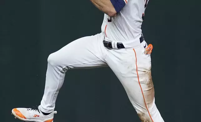 Houston Astros shortstop Jeremy Peña fields an infield single hit by Los Angeles Angels' Jordyn Adams during the fourth inning of a baseball game Thursday, Sept. 19, 2024, in Houston. (AP Photo/Kevin M. Cox)