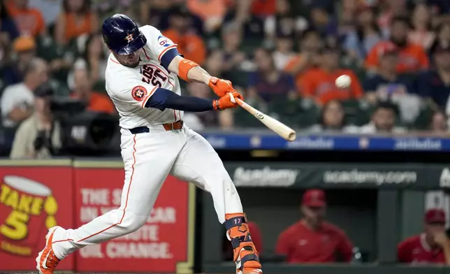 Houston Astros' Victor Caratini hits a three-run home run against the Los Angeles Angels during the third inning of a baseball game, Saturday, Sept. 21, 2024, in Houston. (AP Photo/Eric Christian Smith)