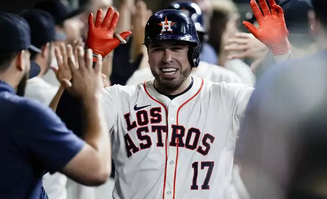 Houston Astros' Victor Caratini (17) celebrates after hitting a three-run home run against the Los Angeles Angels during the third inning of a baseball game, Saturday, Sept. 21, 2024, in Houston. (AP Photo/Eric Christian Smith)