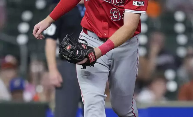 Los Angeles Angels third baseman Eric Wagaman reacts after committing a fielding error on a ground ball hit by Houston Astros' Yainer Diaz during the fourth inning of a baseball game Thursday, Sept. 19, 2024, in Houston. (AP Photo/Kevin M. Cox)