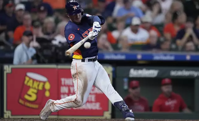 Houston Astros' Alex Bregman hits a two-run home run during the fifth inning of a baseball game against the Los Angeles Angels, Sunday, Sept. 22, 2024, in Houston. (AP Photo/Kevin M. Cox)