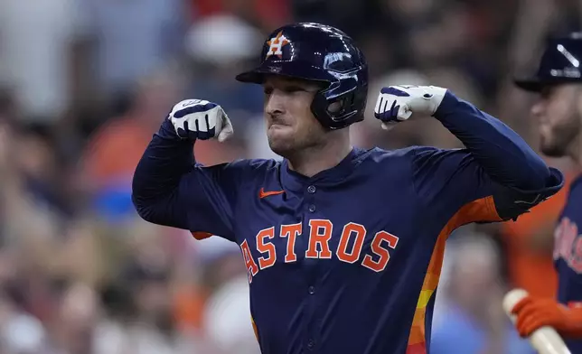 Houston Astros' Alex Bregman celebrates after hitting a two-run home run during the fifth inning of a baseball game against the Los Angeles Angels, Sunday, Sept. 22, 2024, in Houston. (AP Photo/Kevin M. Cox)