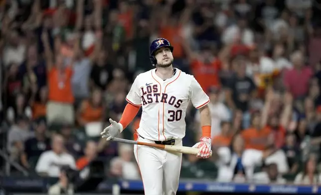 Houston Astros' Kyle Tucker watches his solo home run against the Los Angeles Angels during the seventh inning of a baseball game, Saturday, Sept. 21, 2024, in Houston. (AP Photo/Eric Christian Smith)