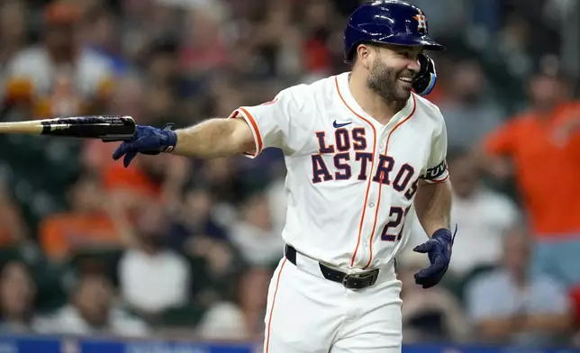 Houston Astros' Jose Altuve laughs after being hit by a pitch by Los Angeles Angels' relief pitcher Michael Stefanic during the eighth inning of a baseball game Saturday, Sept. 21, 2024, in Houston. (AP Photo/Eric Christian Smith)