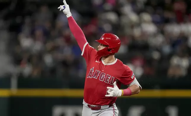 Los Angeles Angels' Logan O'Hoppe celebrates after his three-run home run against the Texas Rangers in the sixth inning of a baseball game Friday, Sept. 6, 2024, in Arlington, Texas. (AP Photo/Tony Gutierrez)