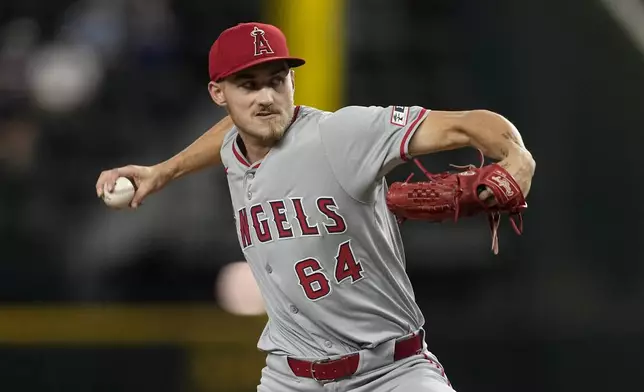 Los Angeles Angels starting pitcher Jack Kochanowicz throws to the Texas Rangers in the second inning of a baseball game Thursday, Sept. 5, 2024, in Arlington, Texas. (AP Photo/Tony Gutierrez)