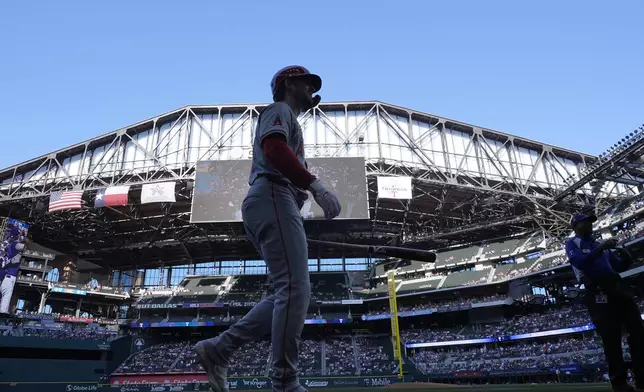 With the roof open, Los Angeles Angels' Taylor Ward walks to bat before a baseball game against the Texas Rangers, Saturday, Sept. 7, 2024, in Arlington, Texas. (AP Photo/LM Otero)