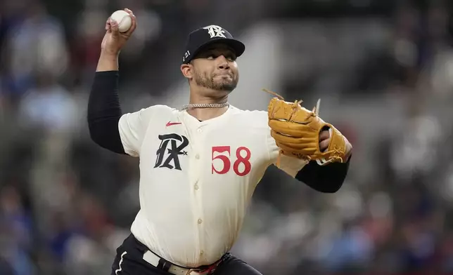 Texas Rangers starting pitcher Gerson Garabito throws in the first inning of a baseball game against the Los Angeles Angels, Friday, Sept. 6, 2024, in Arlington, Texas. (AP Photo/Tony Gutierrez)