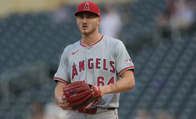 Los Angeles Angels starting pitcher Jack Kochanowicz reacts after a solo home run by Minnesota Twins' Matt Wallner during the first inning of a baseball game Wednesday, Sept. 11, 2024, in Minneapolis. (AP Photo/Abbie Parr)