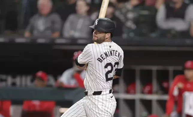 Chicago White Sox's Andrew Benintendi hits an RBI single during the eighth inning of a baseball game against the Los Angeles Angels, Tuesday, Sept. 24, 2024, in Chicago. (AP Photo/Melissa Tamez)