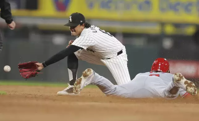 Los Angeles Angels' Taylor Ward steals second base as Chicago White Sox's Nicky Lopez reaches for the throw during the fourth inning of a baseball game, Tuesday, Sept. 24, 2024, in Chicago. (AP Photo/Melissa Tamez)