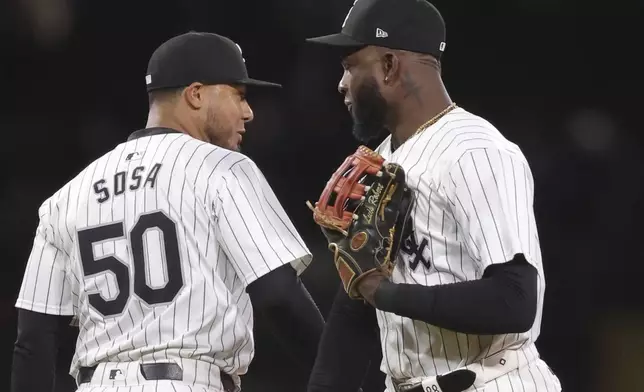 Chicago White Sox's Lenyn Sosa, left, celebrates with Luis Robert Jr., right, after a 3-2 win against the Los Angeles Angels, Tuesday, Sept. 24, 2024, in Chicago. (AP Photo/Melissa Tamez)