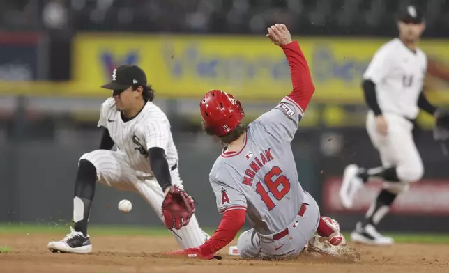 Los Angeles Angels Mickey Moniak steals second base as Chicago White Sox's Nicky Lopez reaches for the throw during the fourth inning of a baseball game, Tuesday, Sept. 24, 2024, in Chicago. (AP Photo/Melissa Tamez)