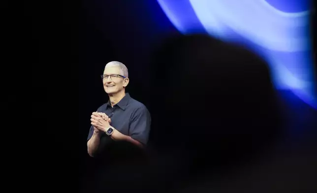 Apple CEO Tim Cook walks on the stage during an announcement of new products at Apple headquarters Monday, Sept. 9, 2024, in Cupertino, Calif. (AP Photo/Juliana Yamada)