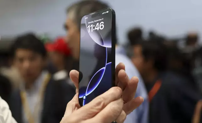 The new iPhone 16 is displayed during an announcement of new products at Apple headquarters Monday, Sept. 9, 2024, in Cupertino, Calif. (AP Photo/Juliana Yamada)