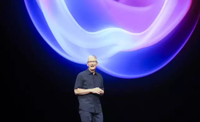 Apple CEO Tim Cook talks on the stage during an announcement of new products at Apple headquarters Monday, Sept. 9, 2024, in Cupertino, Calif. (AP Photo/Juliana Yamada)