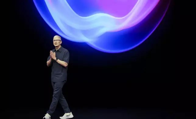 Apple CEO Tim Cook talks on the stage during an announcement of new products at Apple headquarters Monday, Sept. 9, 2024, in Cupertino, Calif. (AP Photo/Juliana Yamada)