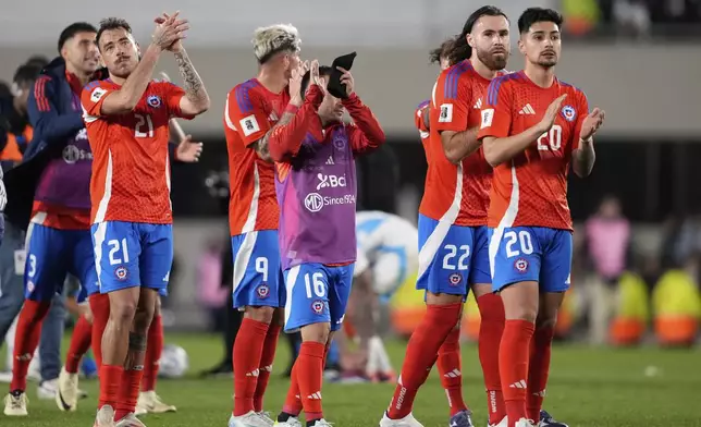 Players of Chile walk off the field after their 3-0 lost against Argentina in a qualifying soccer match for the FIFA World Cup 2026 in Buenos Aires, Argentina, Thursday, Sept. 5, 2024. (AP Photo/Natacha Pisarenko)