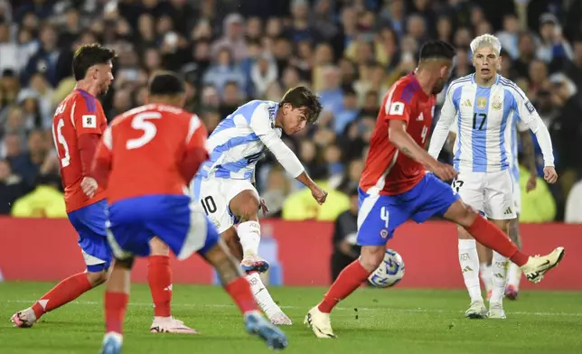 Argentina's Paulo Dybala scores his side's third goal against Chile during a qualifying soccer match for the FIFA World Cup 2026 in Buenos Aires, Argentina, Thursday, Sept. 5, 2024. (AP Photo/Gustavo Garello)