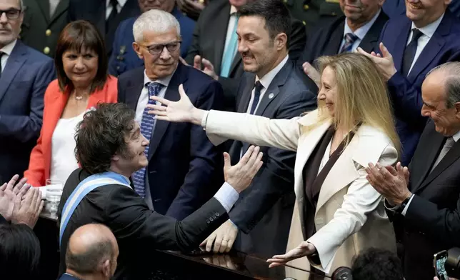 Argentina's President Javier Milei greets his sister Karina Milei as he arrives to Congress to present the 2025 budget in Buenos Aires, Argentina, Sunday, Sept. 15, 2024. (AP Photo/Natacha Pisarenko)