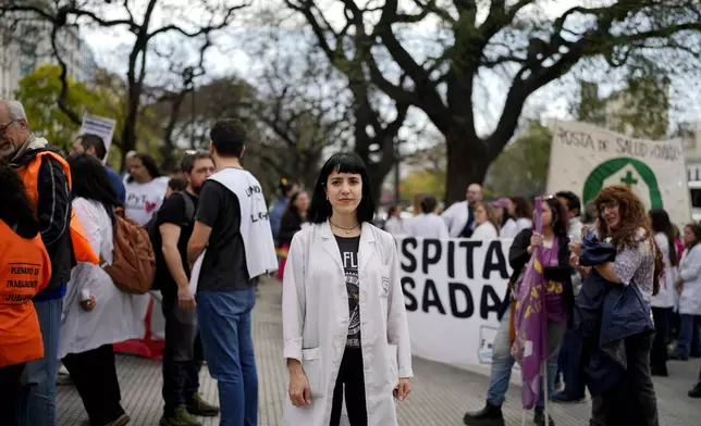 Lab tech Emilce Correa Louzao, who works at the state pediatric Hospital Garrahan, protests at the Heath Ministry demanding a salary raise in Buenos Aires, Argentina, Thursday, Sept. 19, 2024. (AP Photo/Natacha Pisarenko)