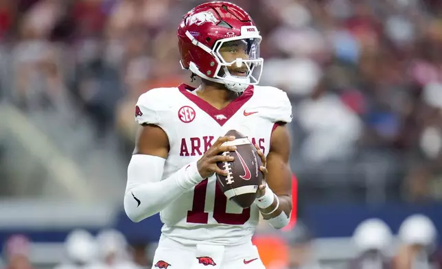 Arkansas quarterback Taylen Green looks to pass against Texas A&amp;M during the first half of an NCAA college football game, Saturday, Sept. 28, 2024, in Arlington, Texas. (AP Photo/Julio Cortez)