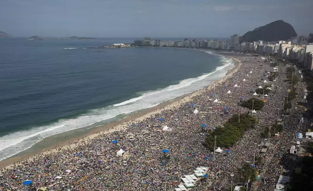 FILE - Crowds line the Copacabana beachfront as they attend the World Youth Day's concluding Mass celebrated by Pope Francis, in Rio de Janeiro, Brazil, on July 28, 2013. Francis wrapped up is historic trip to his home continent Sunday with a Mass that drew a reported 3 million people. (AP Photo/Felipe Dana, File)