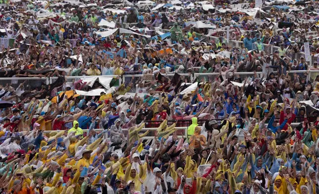 FILE - Worshippers cheer as they wait for the arrival of Pope Francis at Rizal Park in Manila, Philippines on Sunday, Jan. 18, 2015. (AP Photo/Alessandra Tarantino, File)