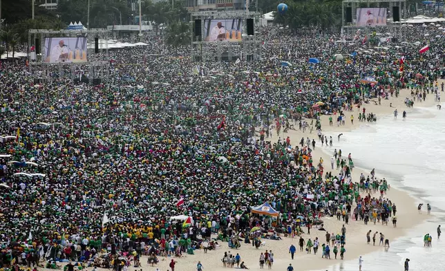 FILE - Crowds attend the World Youth Day's closing Mass line the shore of Copacabana beach in Rio de Janeiro, on July 28, 2013. An estimated 3 million people poured onto the beach for the final Mass of Pope Francis' historic trip to his home continent, cheering the first Latin American pope in one of the biggest turnouts for a papal Mass in recent history. (AP Photo/Domenico Stinellis, File)